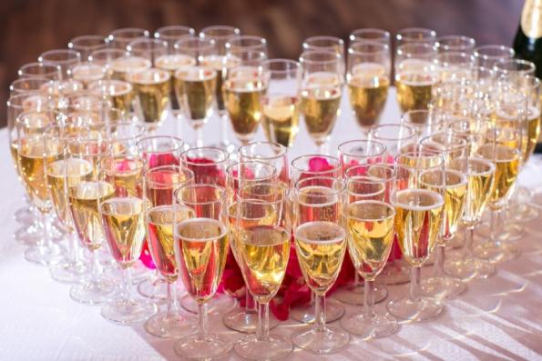 champaign glasses heart catered wedding