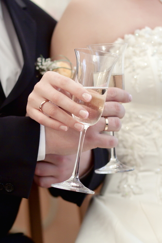 bride and groom with champagne